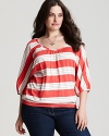 Playful cabana stripes pattern this Splendid top, designed in a relaxed silhouette eased by flowing dolman sleeves.