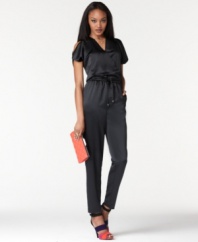 In sleek satin, this Rachel Rachel Roy jumpsuit is oh-so chic for a night on the town! Pair it with statement stilettos to complete the look!