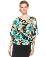 A tropical print adorns this chic Elementz top featuring fluttering batwing sleeves and a flattering banded waist. Pair it with black pants or a maxi skirt for an instantly chic look.