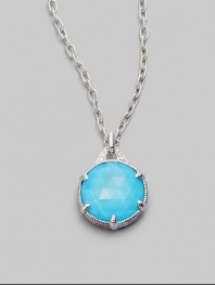 From the Eclipse Collection. A vividly colored, richly faceted turquoise sits in a sterling silver pronged setting with a graceful fluted texture and accents of sparkling white sapphire. Turquoise White sapphire Sterling silver Chain length, about 17 Pendant diameter, about ¾ Lobster clasp Imported