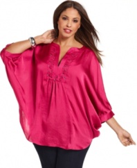Get swept away by the romantic elegance of Alfani's batwing sleeve plus size top, featuring a rosette neckline.