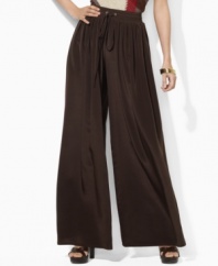 Lauren by Ralph Lauren's breezy wide-leg pant is crafted with a soft sueded crepe construction and finished with a comfortable smocked waistband for ease and style.