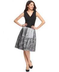 A ruched bodice and ribbon embellishments at the skirt make this SL Fashions dress as full of fun as it is filled with dashing design details.