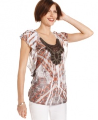 A crochet-inspired applique at the chest of this Style&co. top gives it artisan appeal--a feature that's only accentuated by the sublimated print!