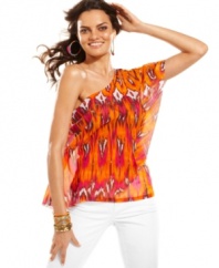 Infuse instant drama to any look with INC's one-shouldered petite top, showcasing a dynamic print.