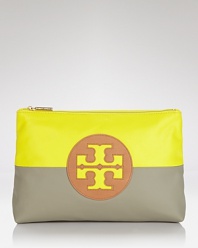 Tory Burch pops and blocks it with this top zip cosmetics case, accented by a bold logo and contrasting neon and neutral hues. It's a bold way to bag your beauty products.