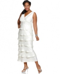 Brilliant for bridal and other elevated occasions, R&M Richards' plus size dress is sparkling perfection with its beaded empire waist and long, tiered silhouette.