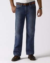Classic-fitting jean in rugged cotton denim, washed for softness. Standard-rise belted waist, zip fly with signature shank. Classic straight leg. Five-pocket jean styling with metal rivets. Polo's signature canvas patch accents the back waist.
