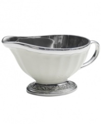 Gently scalloped silhouettes are carved of metal and enamel, creating serveware and serving dishes that embody graceful elegance. This charming gravy boat complements both Italian and French Countryside dinnerware from Mikasa.