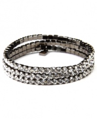 Good things happen in threes! Featuring a triple-row silhouette, Givenchy's gorgeous link bracelet is embellished with glittering glass accents. and crystals. Wear it day or night as a dazzling decorative detail. Made in hematite tone mixed metal. Approximate length: 7-1/4 inches.