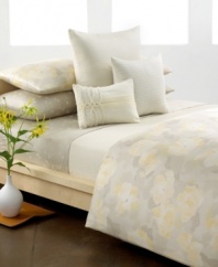 Petal perfect. Fractured florals in soft yellow and cream embellish smooth, gray combed cotton in this Calvin Klein sheet set.