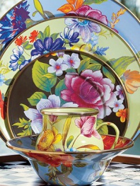 A vibrant bouquet of flowers blossoms on an enameled steel charger, hand decorated to create the ideal touch of color on a summertime table. From the Flower Market Collection Front and back design Bronzed stainless steel rim 12 diam. Dishwasher safe Imported 