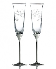 Make defining moments unforgettably elegant with Trousseau toasting flutes, featuring romantic blooms and silver-plated stems for a look of contemporary grace. From Martha Stewart Collection.
