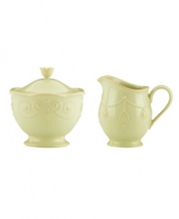With fanciful beading and a feminine edge, this Lenox French Perle sugar and creamer set has an irresistibly old-fashioned sensibility. Hardwearing stoneware is dishwasher safe and, in a soft pistachio hue with antiqued trim, a graceful addition to any meal.