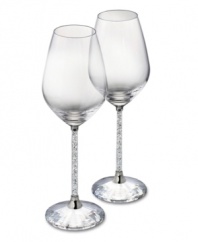 Make it a memorable dining experience with Swarovski Crystalline wine glasses. A faceted base, polished metal accents and stems filled with glittering chatons turn an ordinary meal into cause for celebration.