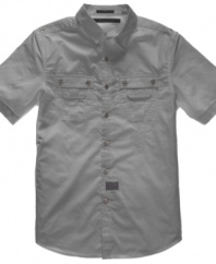Points of pride. Cool buttons stand out on this solid shirt from Sean John.