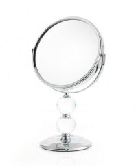 Definitely the fairest of them all, the double Crystal Ball mirror rotates 360 degrees to get every angle and, when you flip it over, magnify your beauty. A brilliant chrome finish and faceted detail add glamor to your daily routine.