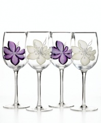 Hand-painted purple and white flowers flourish on this set of Anna Plum wine glasses to complement the Laurie Gates dinnerware pattern.