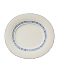 Vintage charm meets modern durability in the Farmhouse Touch oval gourmet plate, featuring cornflower-blue laurels and bands in delicately embossed porcelain from Villeroy & Boch.