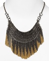 Introduce statement-making chic into your jewelry box with ABS by Allen Schwartz's fringed collar. The chain mail effect adds drama, making this the perfect pick-up to pair with a basic tee.