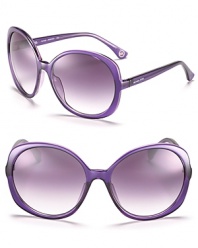 Round oversized sunglassses with plum transparent frames, a perfectly purple pair.