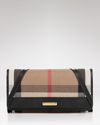 Keep your cash (and card) cache organized with Burberry's check wallet. Take the plaid package into after hours--it doubles as a preppy chic clutch with a black sheath and kitten heels.