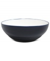 A fresh canvas for casual meals, this fine porcelain vegetable bowl is glazed in solid blue and white to complement the brushed florals of Nikko's Artist Blue dinnerware.