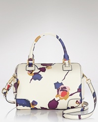 A painterly floral print dresses up this satchel from Tory Burch, designed for versatile style with double top handles and a perfectly proportioned shape.