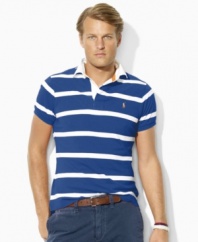 A short-sleeved polo shirt is tailored for a comfortable, classic fit with thin multi-stripes for a sporty appeal.