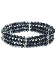 In the navy. Beautiful beads in a dramatic dark blue hue lend an elegant effect to 2028's stretch bracelet. Also adorned with sparkling crystals, it's made in silver tone mixed metal. The stretch design makes it easy and comfortable to wear. Approximate length: 7 inches.