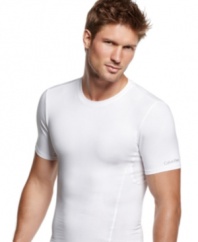 Comfortable enough to wear every day, this slimming compression t shirt from Calvin Klein visibly flattens your midsection for a sleek silhouette.