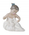A lasting impression of sheer comfort and contentment, this handmade porcelain figurine depicts a toddler cherishing her first blanket.