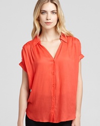 A versatile go-with-all, this sheer Aqua button-down top pairs with sleek denim for cool-girl weekend style.