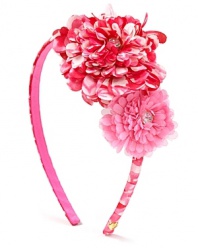 Her finishing touch, the Juicy Couture headband with two fabric flowers and rhinestone detail.