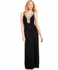 A beaded crochet inset adds a stylish flair to this Calvin Klein solid maxi dress -- perfect for easy elegance!