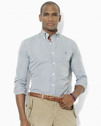 A polished bengal stripe motif adds timeless style to a trim-fitting sport shirt in crisp cotton poplin.