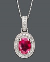 Keep this stunning king of gemstones close to your heart. Oval-cut ruby (1-1/2 ct. t.w.) pendant in 14k white gold setting encrusted with round-cut diamond (1/5 ct. t.w.). Approximate length: 18 inches. Approximate drop: 7/8 inch.