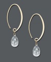 A simple hoop with an extra touch of sparkle. These elegant earrings feature a 14k gold setting with a faceted crystal teardrop. Approximate drop: 1-1/2 inches.