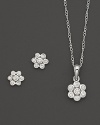 Young and glamorous: Mini diamond flower earrings and pendant necklace in white gold.