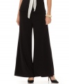 A flare-leg silhouette creates a dramatic look on these elegant matte jersey pants from Onyx.