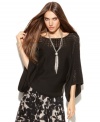 INC's elegant pointelle-knit sweater creates a dramatic look with just a hint of skin and flowing kimono sleeves!