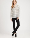 Ruffled neckline and houndstooth-inspired check print renew this lightweight silk blouse. Ruffled necklineLong sleeves with buttoned cuffsButton frontSilkDry cleanImportedModel shown is 5'9½ (176cm) wearing US size Small.