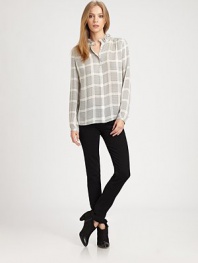 Ruffled neckline and houndstooth-inspired check print renew this lightweight silk blouse. Ruffled necklineLong sleeves with buttoned cuffsButton frontSilkDry cleanImportedModel shown is 5'9½ (176cm) wearing US size Small.