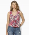 Lauren Jeans Co.'s ruffled neckline and laced detailing adds a feminine flourish to the sleeveless top, fashioned in a vibrant cotton plaid for timeless style.