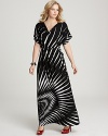 Adjust the waistline and sides of this starburst-printed Melissa Masse Plus maxi dress to craft a silhouette that's just-right for you.