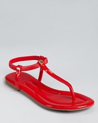 Slick and simple, the Tory Burch Vickie sandals lend summer style in glossy patent leather. A stretchy ankle strap allows for easy on-and-off.