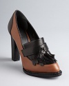 Rachel Roy gives the menswear-influenced oxford trend a femme spin, in lofty heels with kiltie details.