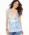 One World's floral tunic features a feminine lace yoke and a tiered hem. Studs give it just the right amount of edge!