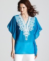 Lend a touch of boho-chic to your daily repertoire with this Karen Kane top touting glistening metallic embroidery.