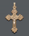 Cherish your beliefs by wearing them proudly. Intricate cross pendant features a scrolling design crafted in 14k gold. Approximate drop width: 3/4 inch. Approximate drop length: 1-1/4 inches.